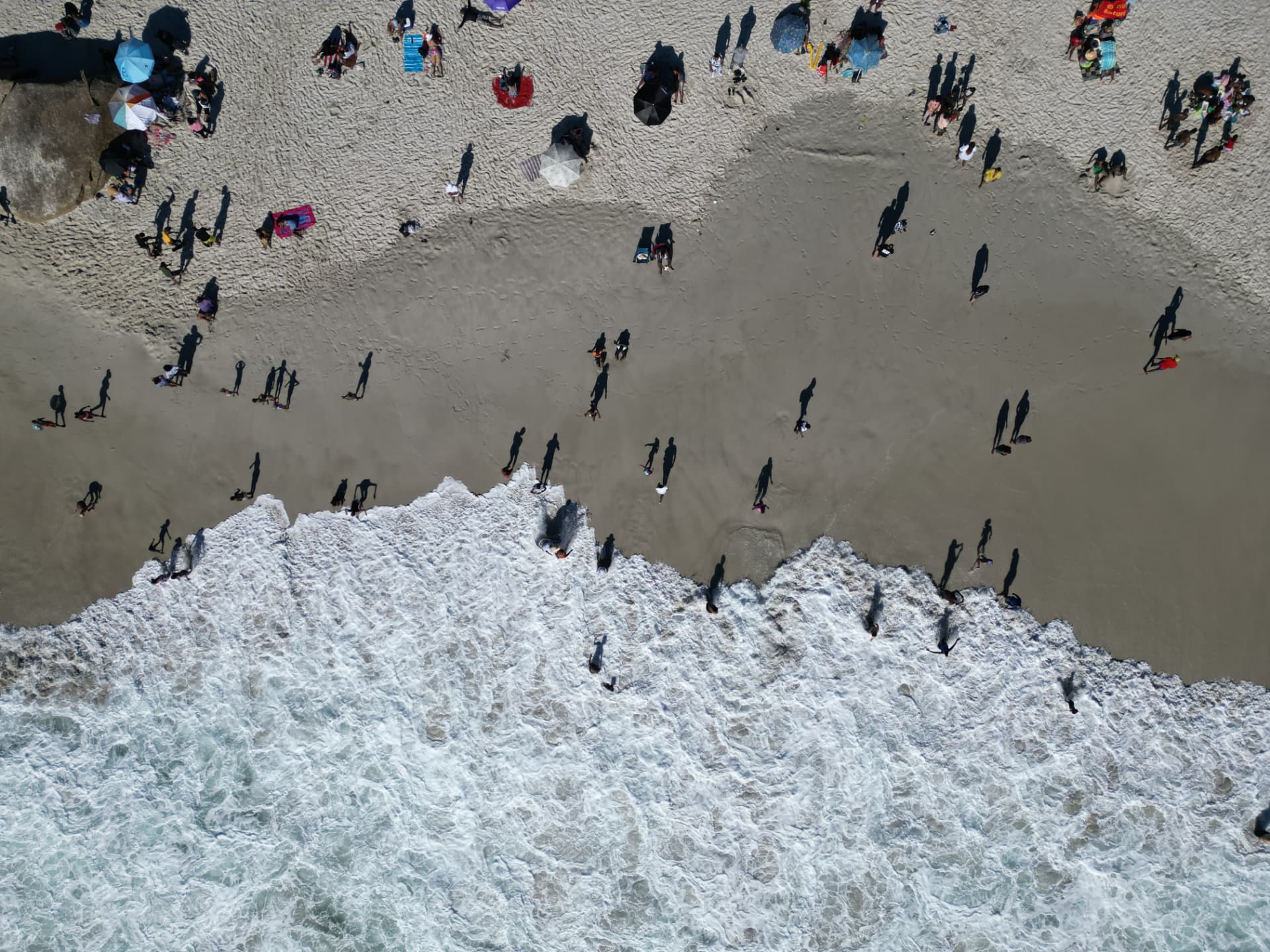Sunlight and shadow on the shoreline from above